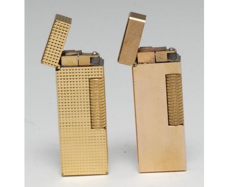 A Dunhill gold plated lighter, engine turned, 6.5cm long; another (2) 