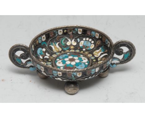 A Russian silver and cloisonne enamel vodka tot, profusely decorated with flowers and scrolling leaves, ball feet, 8cm over h