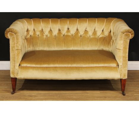 A late Victorian/Edwardian Chesterfield sofa, of small and neat proportions, deep-buttoned champagne upholstery, tapered squa