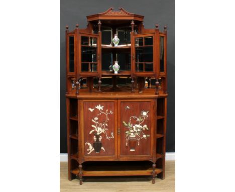 An Aesthetic Movement Anglo-Japanese drawing room or parlour corner display cabinet, swan neck pediment above a pair of mirro