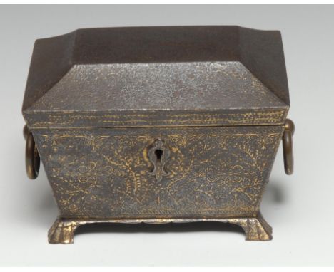 A Persian gold-damascened iron sarcophagus-shaped table casket, decorated in the Islamic taste, ring handles, bracket feet, 1