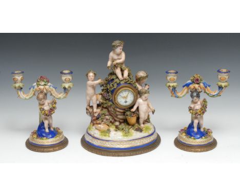 A French Rococo style porcelain garniture, 5cm white enamel dial inscribed with Arabic numerals and subsidiaries, painted wit
