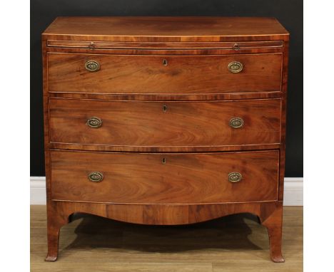 A George IV mahogany bow front caddy top chest, flush top above a slide and three long graduated cockbeaded drawers, oval rop