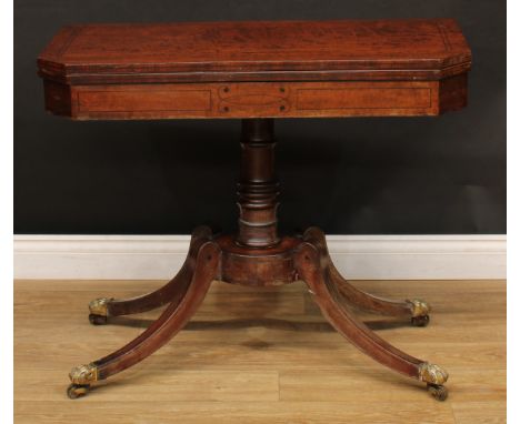 A Regency mahogany card table, hinged top enclosing a baize lined playing surface, turned column, circular base, sabre legs, 