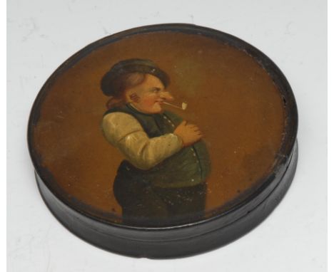 A 19th century papier mache circular table snuff box, the cover painted in polychrome with a gentleman smoking a clay pipe, 1