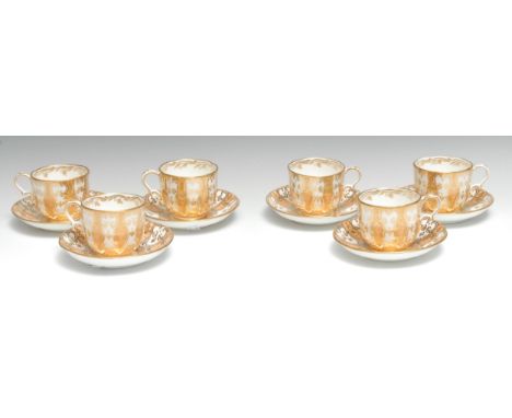 A set of six 19th century Davenport coffee cups and saucers, printed in gilt on a salmon ground, pattern A3224 