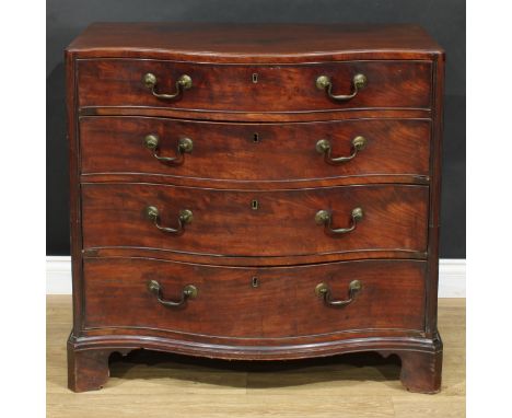 A George III mahogany serpentine caddy top chest, of four long graduated cockbeaded drawers, flanked by stop-fluted forestile