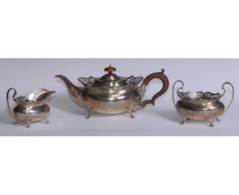 A George V silver tea service, pierced rims, pad feet, Thomas Edward Atkins, Birmingham 1917, 1113g, 36ozt 