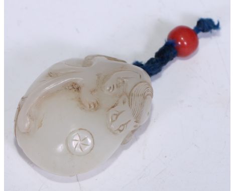 A Chinese pale nephrite boulder pendant, carved with chilong and bat, Qing dynasty, 3.5cm high. 