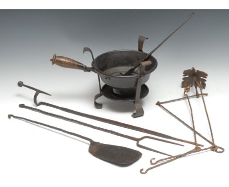 A 19th century tripod brazier, turned handle, 34cm long; a wrought iron roasting fork; etc 