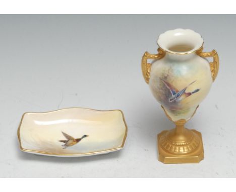 A Royal Worcester pedestal  two-handled vase, painted by James Stinton, signed, decorated with a mallard in flight, gilt leaf