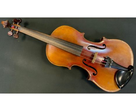 A German violin, 36cm two piece back excluding button, the interior with paper label stamped Antonius Stradivarius Cremonensi