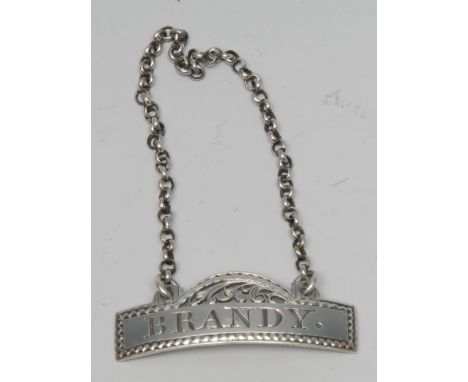 Hester Bateman - a George III bottle ticket or decanter label, Brandy, bright-cut engraved border, 4.6cm wide, maker's mark a