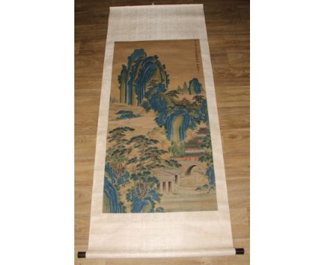 Chinese School, Jiao Dongshen, a scroll,  ink and colour on silk,  painted with a monumental landscape with pagodas, 116cm x 
