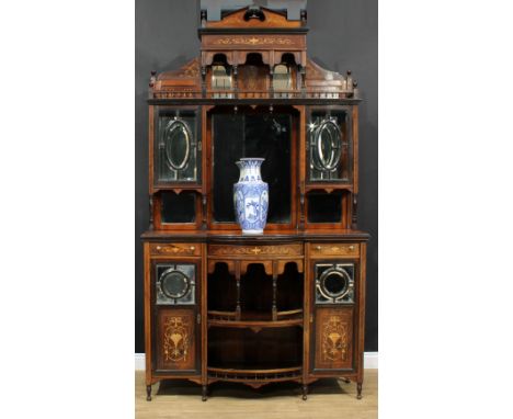 An Edwardian rosewood and marquetry drawing room or parlour cabinet, broken-arch pediment flanked and centred by turned finia