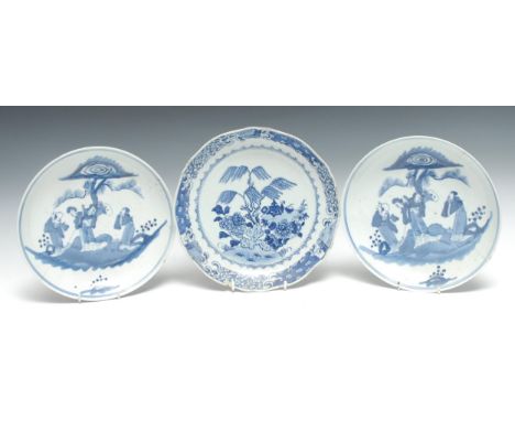 A pair of Chinese dished plates, decorated in underglaze blue with figures and pine tree, tramline border, 24cm diam, four ch