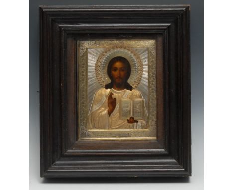 A 19th century Russian silver and silver-gilt Orthodox icon, painted with Christ holding the Scriptures and making a chrirono