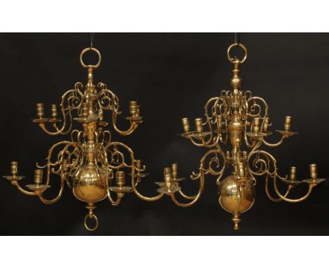 A near pair of Dutch brass twelve-light chandeliers, 64cm high overall, 61cm wide 