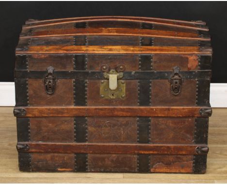 A 19th century wood-bound leather dome-top steamer trunk, tooled with geometric motifs and an eight-pointed star, hinged cove