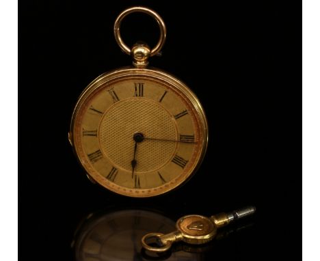 An 18ct gold open face pocket watch, the matt and engine turned dial with Roman numerals, the case with vacant foliate shield