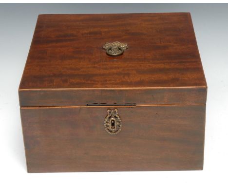 An unusual and large late George III mahogany square double-tea caddy, the hinged cover enclosing a pair of hinged removable 