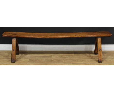 A 19th century fruitwood bench, rectangular seat, outswept legs, 45cm high, 180.5cm long, 25cm deep 
