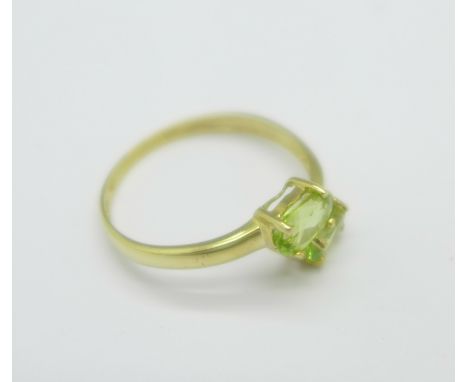 A 9ct gold, peridot and diamond ring, 1.1g, O