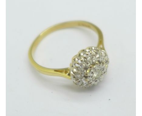 An 18ct gold and diamond cluster ring, 2.9g, O