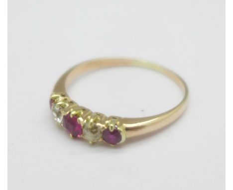 An 18ct gold and five stone diamond and ruby ring, 1.6g, M