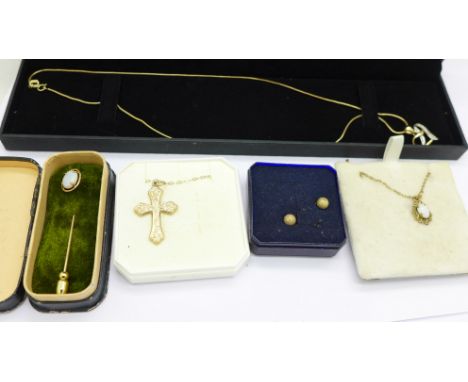 A collection of 9ct gold jewellery including a fine chain with heart shaped pendant, a cross and chain and an opal stick pin,