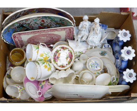 A box of china including crested, a Royal Worcester pot, a figure group, tea ware and a candlestick