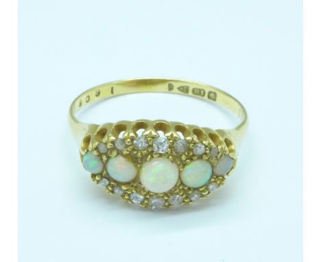 An 18ct gold, opal and diamond ring set with fourteen diamonds and five opals, 3.1g, S, Chester hallmark