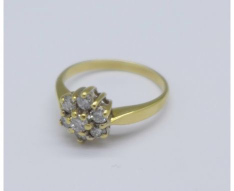A yellow metal and diamond cluster ring, 3.4g, N