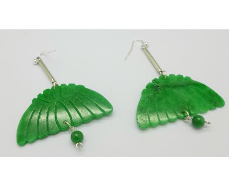A pair of large jade earrings