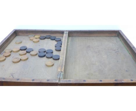 A 19th Century games box with twenty-eight checkers