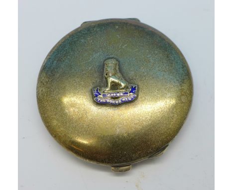 A white metal compact with enamelled front, 2nd Battalion The Burma Regt., gross weight 78.1g, a/f