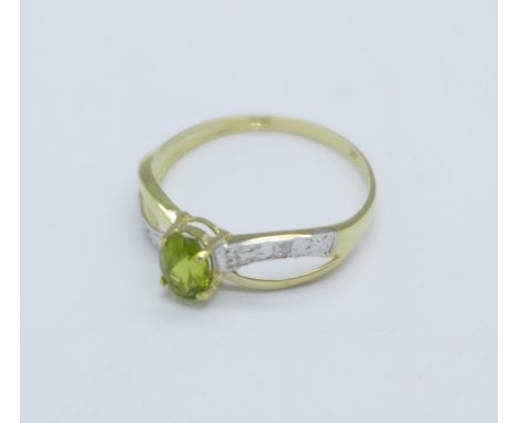 A 9ct gold, peridot and diamond ring, 0.9g, O