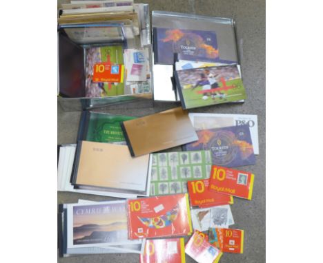 A quantity of mint stamp presentation packs and booklets, face value approximately £270, postal history and first day covers