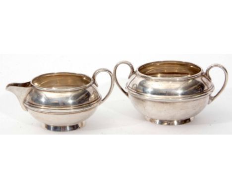 Edward VII sugar basin and milk jug each of compressed circular form with girdled bodies, width of sugar basin 13.5cm, combin