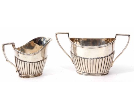 Mixed Lot: comprising non-matching bachelor's two handled sugar basin and milk jug, each of polished oval form with half flut