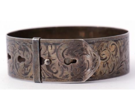 Hallmarked silver belt design bangle, chased and engraved with a foliate design, hallmarked Chester, maker's mark C.H, 23.6gm