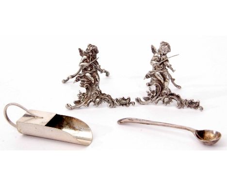 Mixed Lot: comprising two easel backed menu holders, each cast in the form of a putti playing a violin on a plinth with scrol