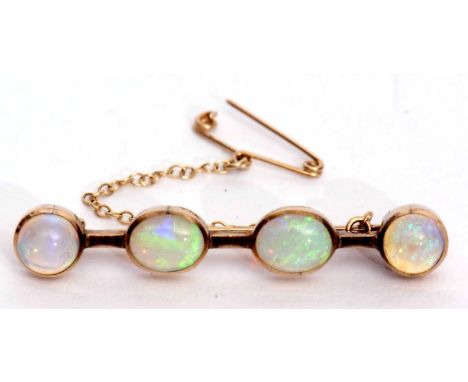 Opal bar brooch featuring two oval and two circular shaped cabochon opals, each collet set, 4.5cm long, stamped 9ct