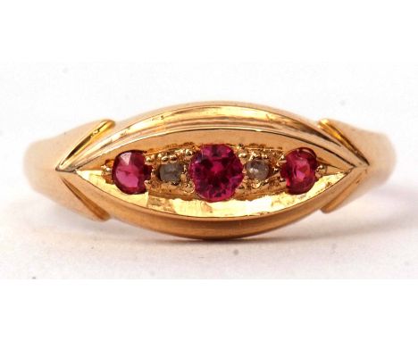 An 18ct gold ruby and diamond ring, boat shaped featuring three graduated rubies interspersed with two small diamonds, hallma