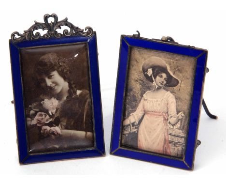 Two late Victorian Continental silver gilt and enamelled easel backed picture frames, each of rectangular form with cobalt bl