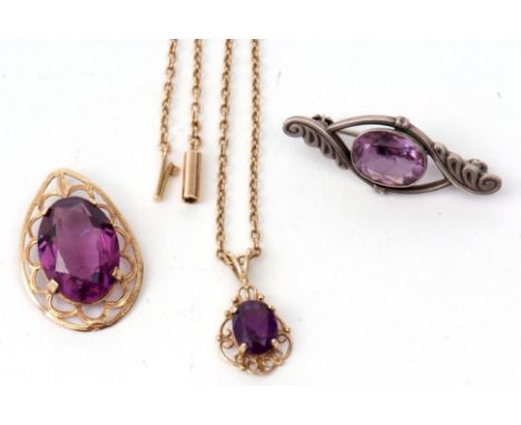 Mixed Lot: 9ct gold and amethyst pendant suspended from a 15c stamped chain, a 9ct framed purple stone pendant, together with