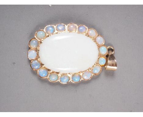 A yellow metal and opal pendant 