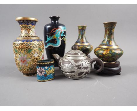 A Chinese Yixing miniature teapot with white metal mounts, dragon decoration, and impressed seal mark to base, a pair of cloi