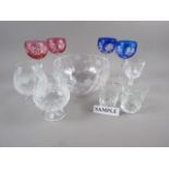 Four coloured and cut glass hocks, a pair of engraved brandy balloons, a similar bowl and other