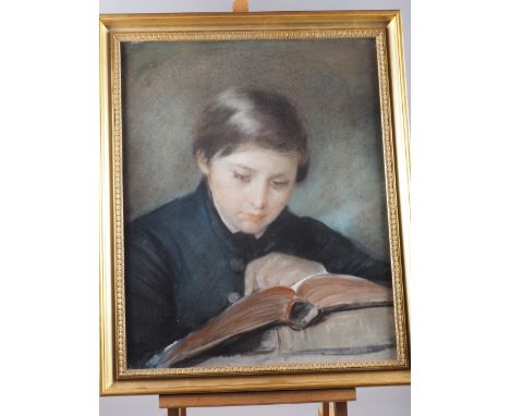 English School: pastels, portrait of a boy reading, 21 1/2" x 17", in gilt strip frame